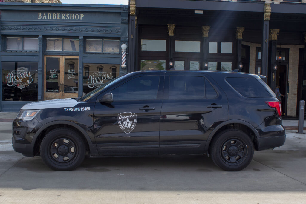 Apache Patrol Car in front of a barbershop in Downtown Bryan